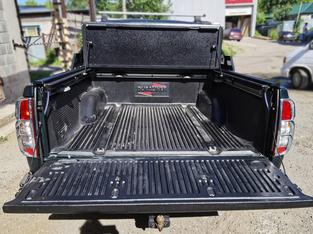 Крышка 4-х секционная HAL 4S PRO для Nissan Navara (Frontier) III (D40) Рестайлинг