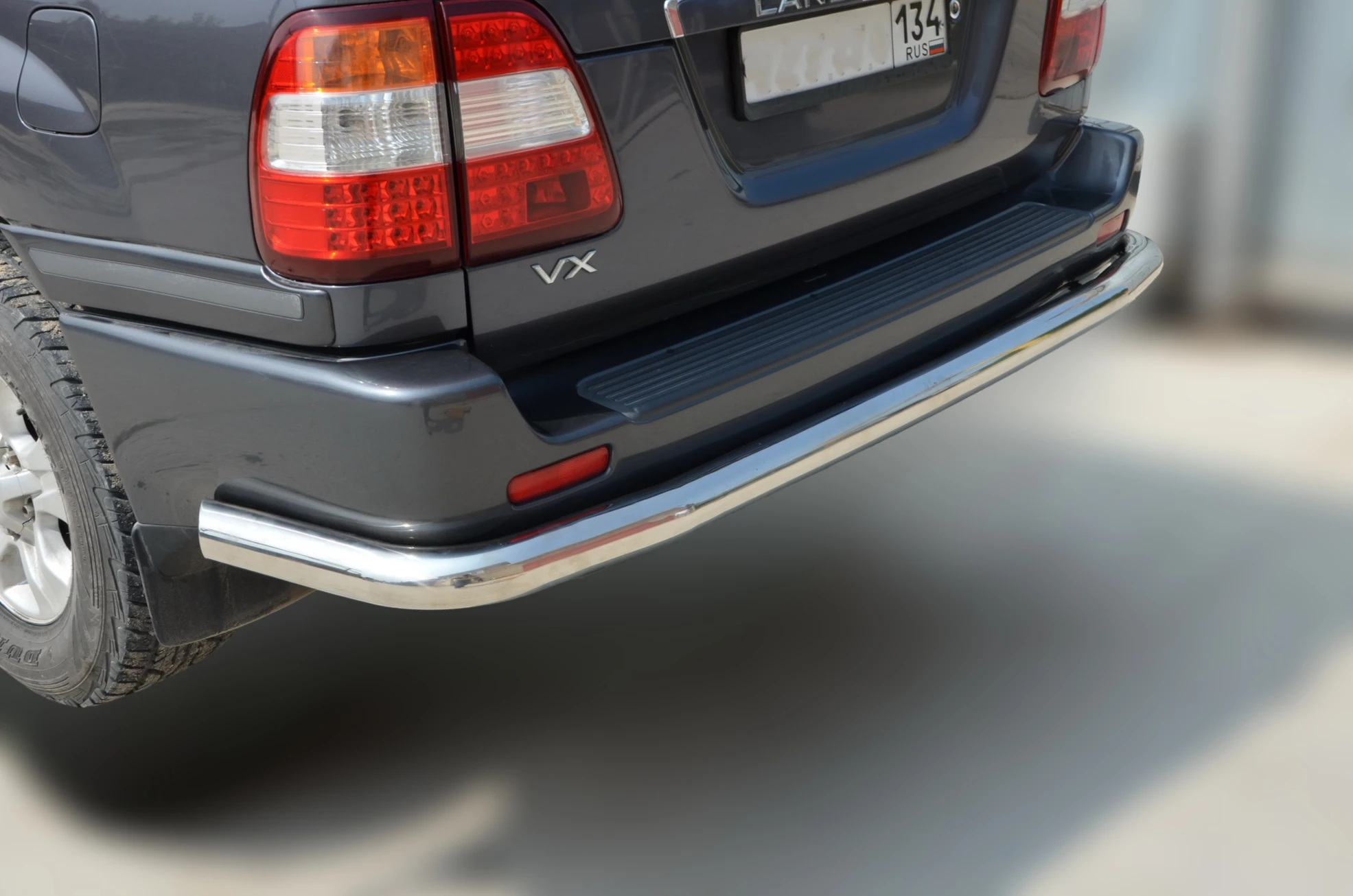 Защита заднего бампера угловая большая d76 мм для Toyota Land Cruiser 100 Series Рестайлинг 1  Юко TLC100.98.18
